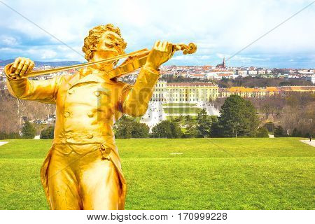 Johann Strauss statue, Schonbrunn view and Vienna panoramic skyline background, Austria