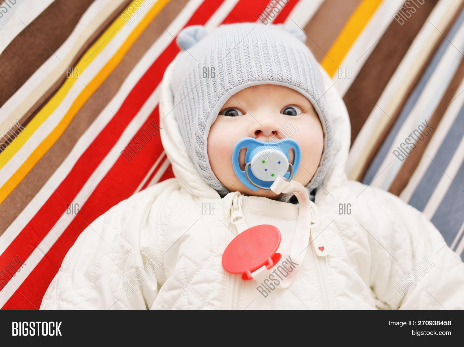 baby wearing cap