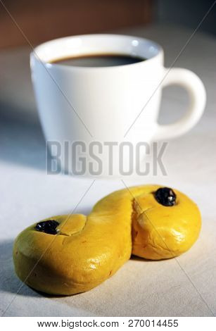 Saffran Bun With Raisin And A Cup Of Coffee