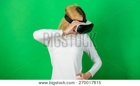 The Woman With Glasses Of Virtual Reality. Woman With Virtual Reality Headset. Funny Woman Experienc