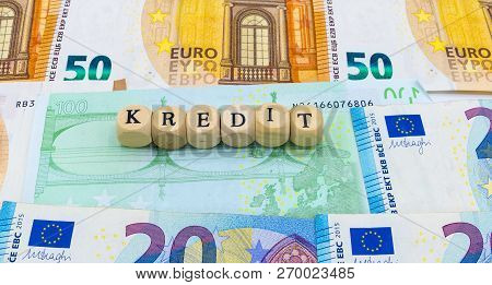 Wooden Letters On Banknotes Credit German Symbolic