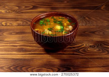 Kharcho Soup With Meat And Rice On Wooden Table