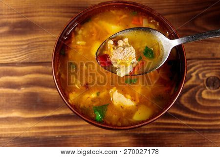 Kharcho Soup With Meat And Rice On Wooden Table. Top View