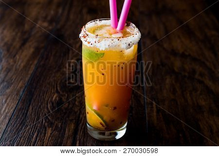 Mexican Michelada Cocktail With Beer, Lime, Ice And Spices..