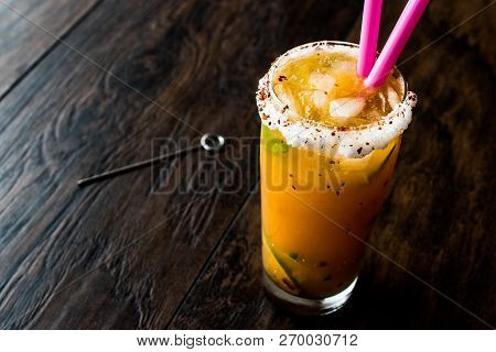 Mexican Michelada Cocktail With Beer, Lime, Ice And Spices..