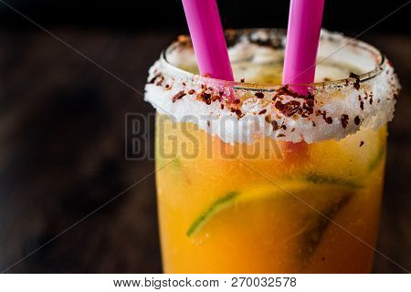 Mexican Michelada Cocktail With Beer, Lime, Ice And Spices..