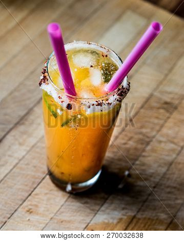 Mexican Michelada Cocktail With Beer, Lime, Ice And Spices.
Beverage Concept.