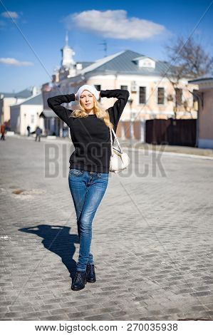 Street Fashion Look. Beautiful Girl In Black Hoody