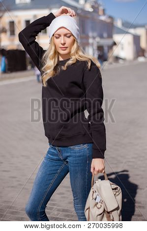 Street Fashion Look. Beautiful Girl In Black Hoody