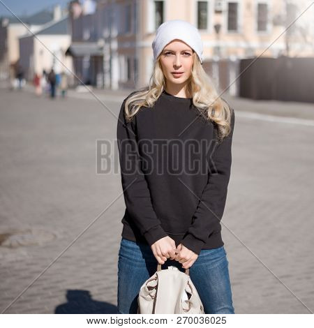 Street Fashion Look. Beautiful Girl In Black Hoody