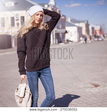 Street Fashion Look. Beautiful Girl In Black Hoody