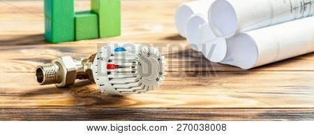Thermostatic Head Valve For Radiator Heater And Green House Of Cubes On Wooden Background Heating Pr