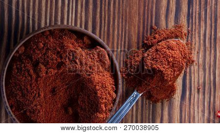 Red Paprika , Powder, In Wooden Backgrond Close Up