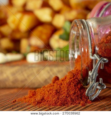 Red Paprika , Powder, In Wooden Backgrond Close Up