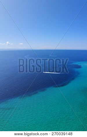 Drone Aerial View Of Blue Sea Water And One Boat