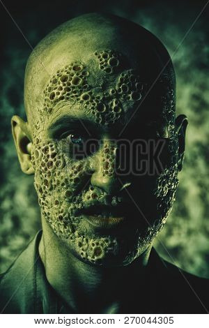 A close up portrait of a sick man in the grey light. Desparation, hopelessness.