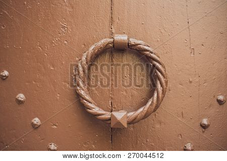 Door Handles With An Old Double Door. Golden Handle Door Entrance. Luxury Gold Handle. Classical Sty