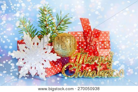 Gift Box Red With White Polka Dots With A Bow The Branches Of A Christmas Tree Gifts Toy Ball On A S
