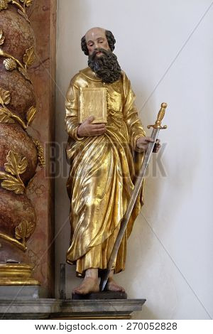 RETZBACH, GERMANY - JULY 04, 2018: Saint Paul statue on the Beheading of John the Baptist altar in Maria im Grunen Tal pilgrimage church in Retzbach in the Bavarian district of Main-Spessart, Germany