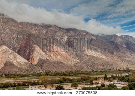 Village Maimara Under Colorful Rock Called Paleta Del Pintor Painters Palette In Quebrada De Humahua