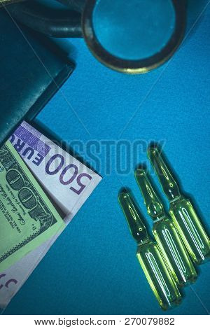 Drugs Are Opiates In Pills And Ampoules. Money, Pills And A Stethoscope On The Table Close-up. Kickb