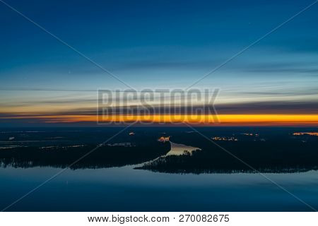 Beautiful River With Big Island With Trees Under Predawn Sky. Bright Yellow Stripe In Picturesque Cl