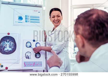 Happy Asian Medical Worker Presenting Results Of Research