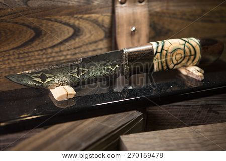 Knife With A Blade Of Damascus Steel