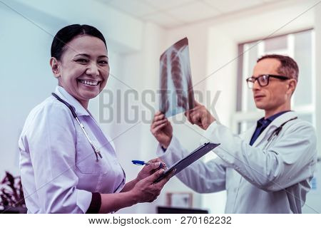 Positive Delighted Female Person Looking At Camera
