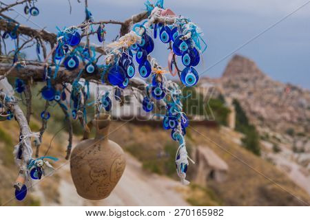 A Vintage Tree Decorated With Non-commercial Evil Eyes Pots Cappadocia. Uchisar. Evil Eye Is A Turki