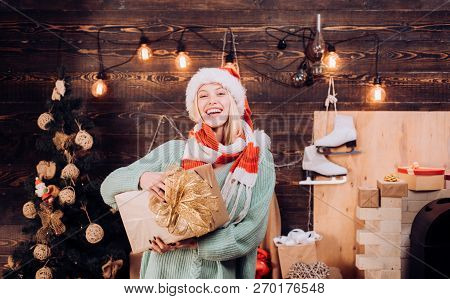 Merry Christmas And Happy Holidays. Happy Girl With Christmas Present Gift The Morning Before Xmas. 