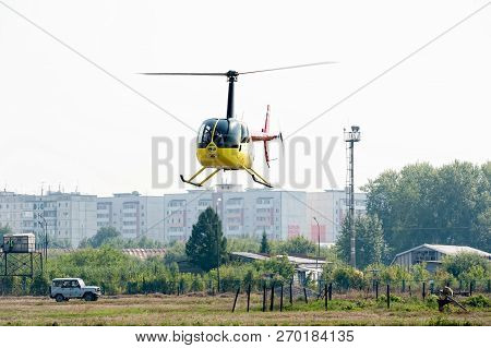 Tyumen, Russia - August 11, 2012: On A Visit At Utair Airshow In Heliport Plehanovo. Pilot Of Robins
