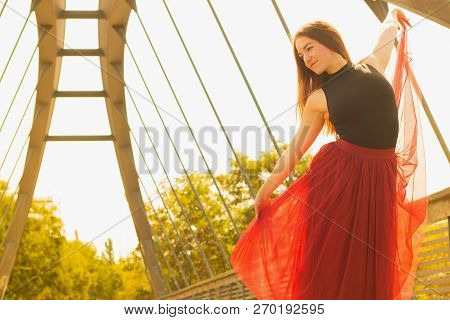 Young Slim Woman With Long Brown Hair Dancing