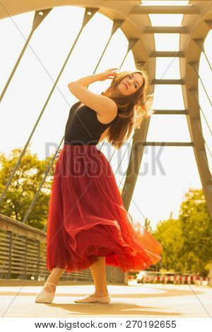 Young Slim Woman With Long Brown Hair Dancing
