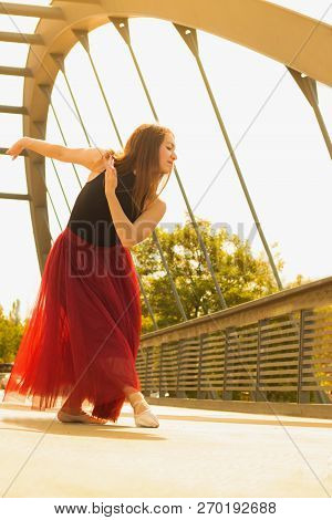 Young Slim Woman With Long Brown Hair Dancing
