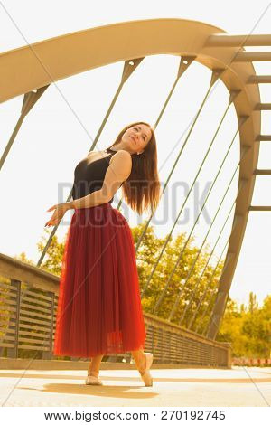 Young Slim Woman With Long Brown Hair Dancing