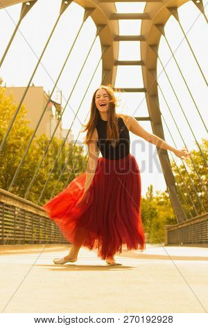 Young Slim Woman With Long Brown Hair Dancing