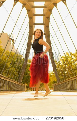 Young Slim Woman With Long Brown Hair Dancing