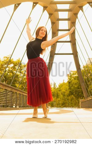 Young Slim Woman With Long Brown Hair Dancing