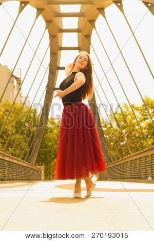 Young Slim Woman With Long Brown Hair Dancing