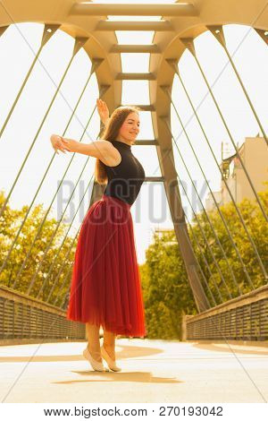 Young Slim Woman With Long Brown Hair Dancing
