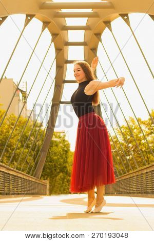 Young Slim Woman With Long Brown Hair Dancing