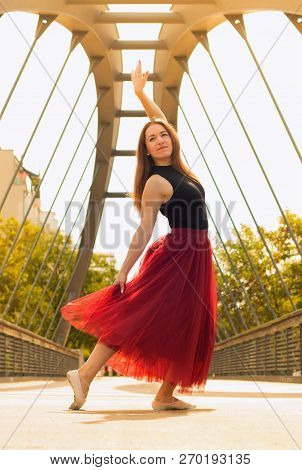 Young Slim Woman With Long Brown Hair Dancing