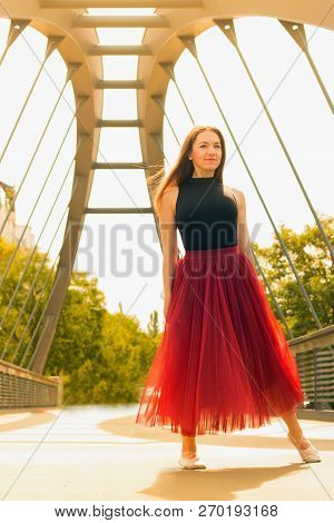 Young Slim Woman With Long Brown Hair Dancing