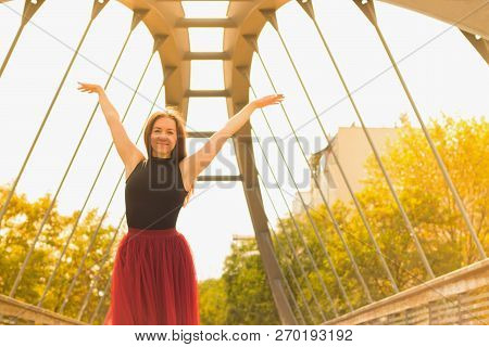 Young Slim Woman With Long Brown Hair Dancing