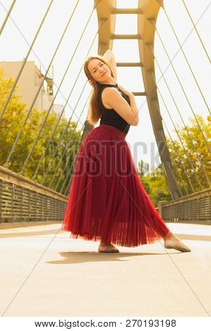 Young Slim Woman With Long Brown Hair Dancing