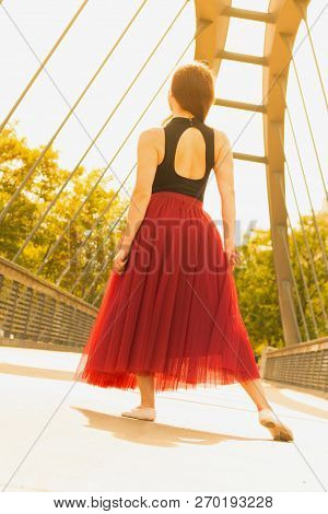 Young Slim Woman With Long Brown Hair Dancing