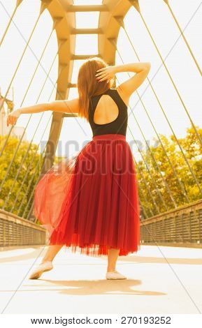 Young Slim Woman With Long Brown Hair Dancing