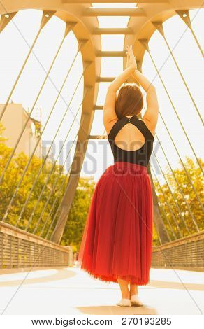 Young Slim Woman With Long Brown Hair Dancing