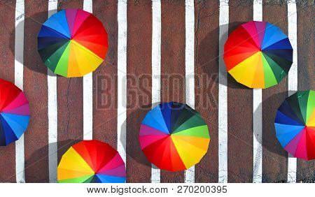 People Walking With A Colorful Umbrellas On A Pedestrian Crossing. Happiness And Peace Concept Aeria